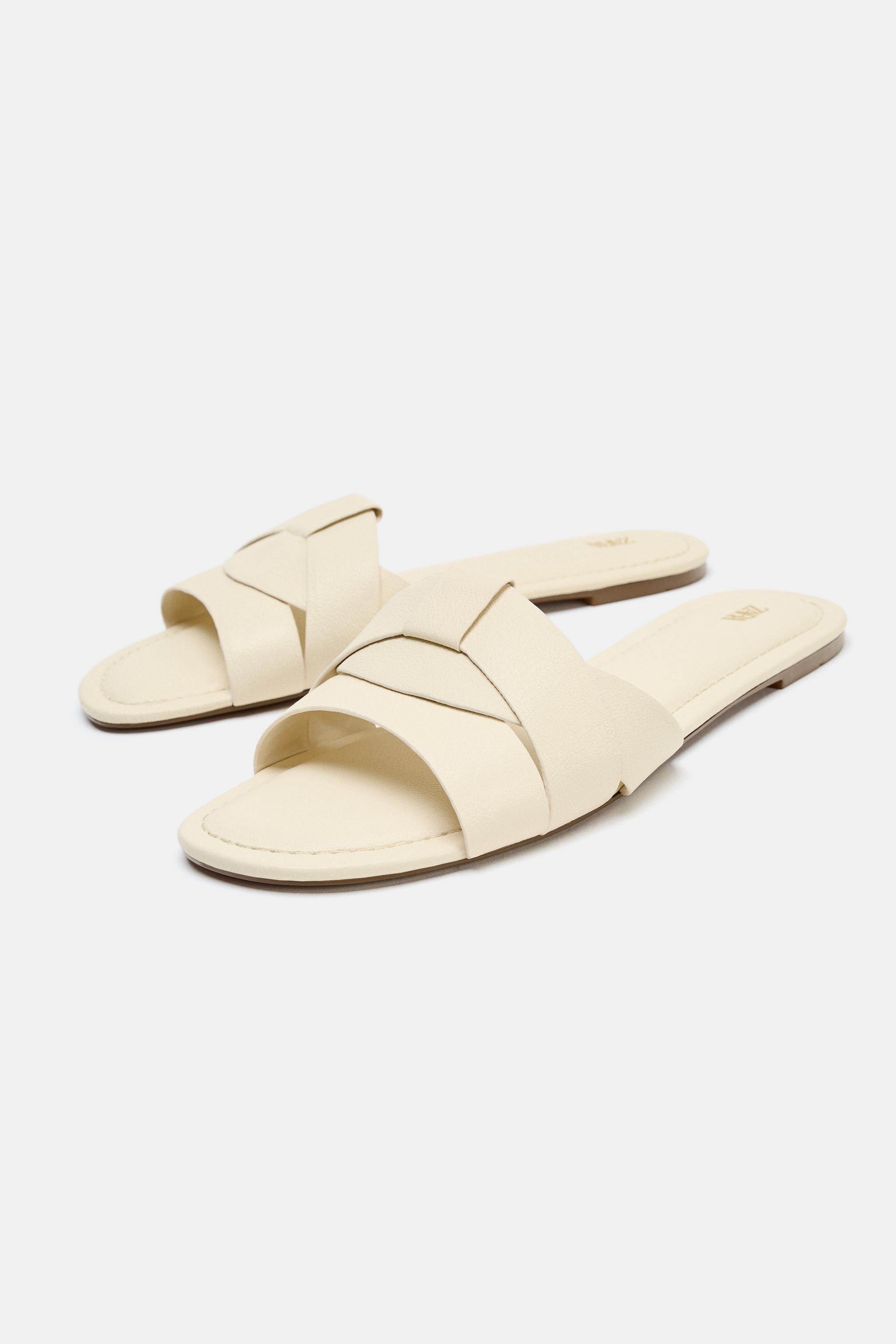 SANDALES PLATES EN CUIR À BRIDES CROISÉES